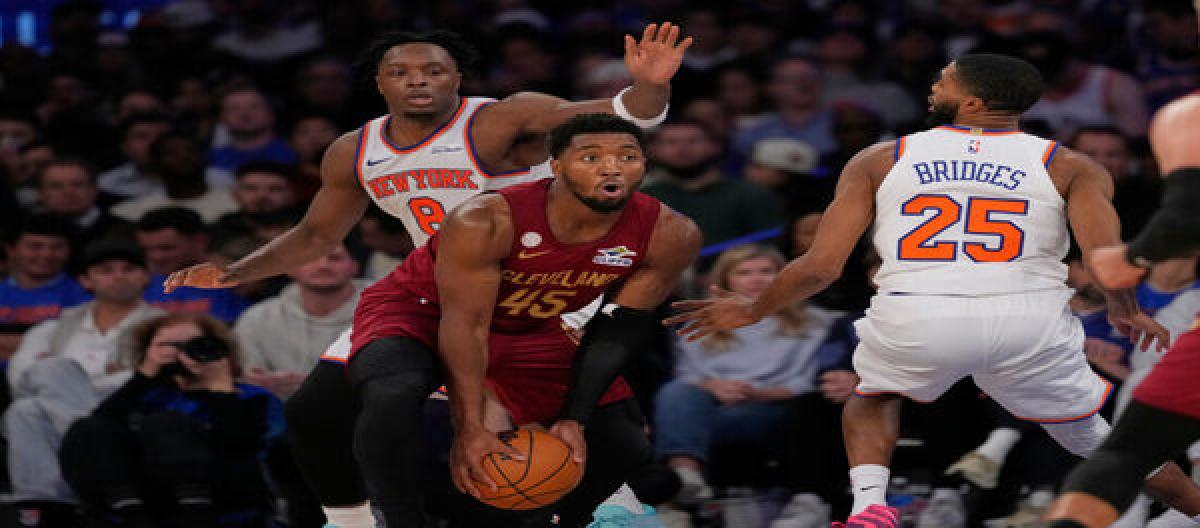 Mitchell scored 31 points but the Knicks defeated the Cavaliers 119-111, giving Brown his first win as coach.