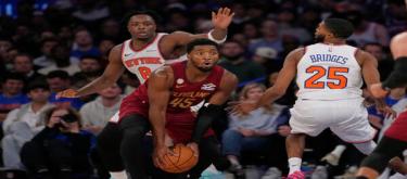 Mitchell scored 31 points but the Knicks defeated the Cavaliers 119-111, giving Brown his first win as coach.