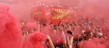Arsenal break 22-year title drought with a city-wide parade celebrating their Premier League title win.