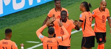 World Cup – Netherlands defeated Tunisia 3-1 to advance to the round of 32 as group winners.